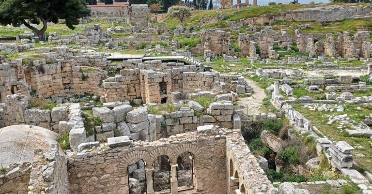 Explore the ancient ruins of Corinth, Greece, showcasing historic stone structures and landscapes.